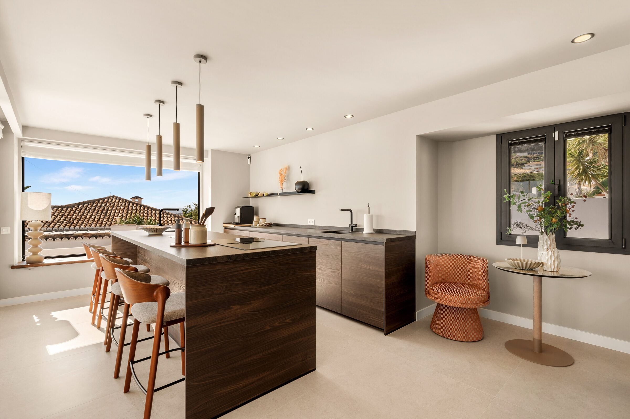 Kitchen with large central island and sea views